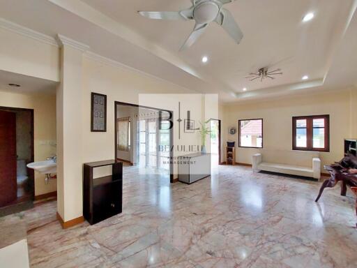 Spacious and well-lit living room with modern decor