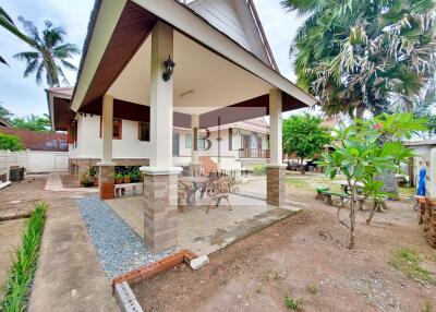 Exterior view of house with surrounding garden