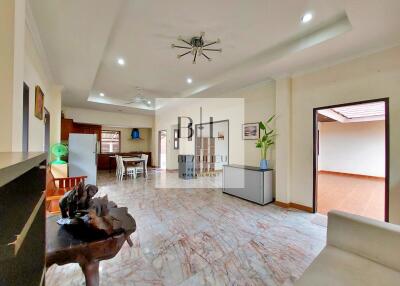 Spacious living room with marble flooring