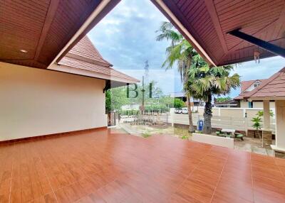 spacious covered patio with tiled flooring