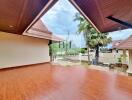 spacious covered patio with tiled flooring