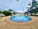 Outdoor pool area with palm trees