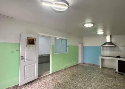 Spacious kitchen with tiled floor and large windows