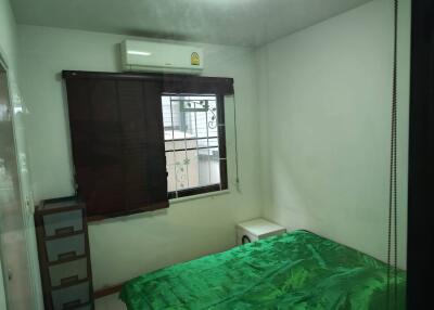 Bedroom with air conditioner and window