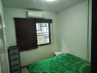 Bedroom with air conditioner and window