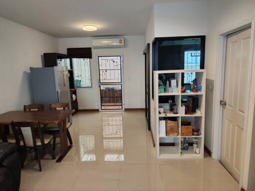 Modern kitchen and dining area with storage shelves