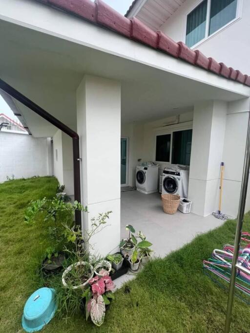 Outdoor laundry area with washing machines