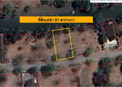 Aerial view of an empty plot of land lined out in yellow