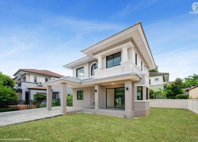 Two-story modern house exterior with lawn