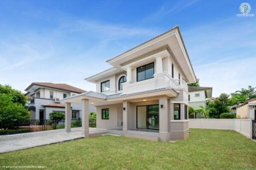 Two-story modern house exterior with lawn