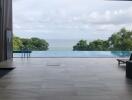 Infinity pool view of the ocean and lush greenery