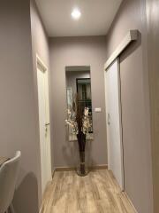 Hallway with wooden flooring and modern decor