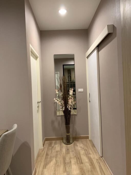 Hallway with wooden flooring and modern decor