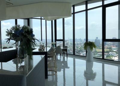 Modern high-rise living space with large windows and city view