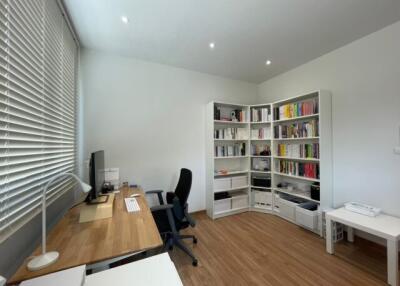 Modern home office with desk and bookcases