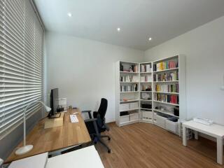 Modern home office with desk and bookcases