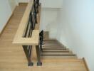 Wooden staircase with black railing