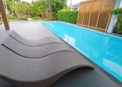 outdoor pool area with lounge chairs