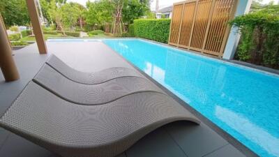 outdoor pool area with lounge chairs