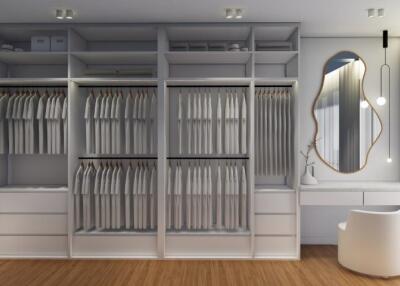 Spacious walk-in closet with ample storage and vanity area