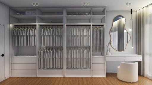 Spacious walk-in closet with ample storage and vanity area