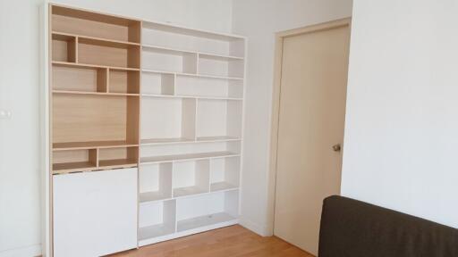 Modern built-in shelving unit in a bright living room