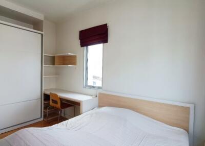 Bright bedroom with storage and study desk