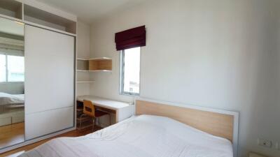 Bright bedroom with storage and study desk