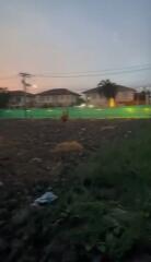 Empty lot in a residential area at dusk