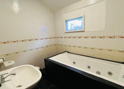 Bathroom featuring a bathtub and sink