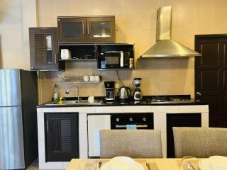 well-equipped kitchen with modern appliances