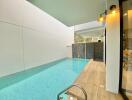 Modern outdoor pool area with warm lighting