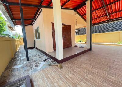 Covered patio area with tile flooring