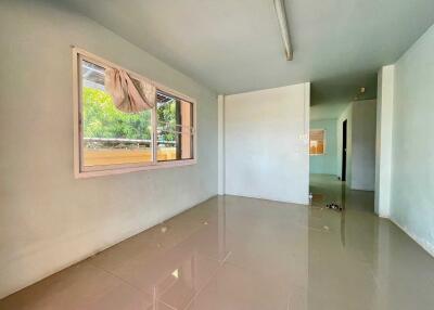 Empty living room with large window