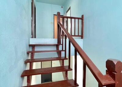 Wooden staircase with blue walls