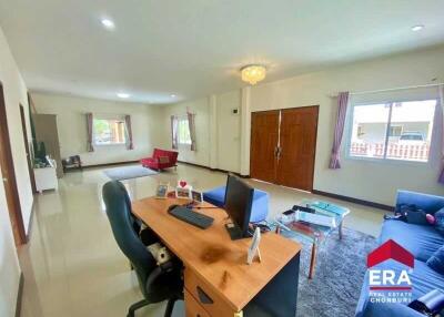 Spacious living room with desk and seating area