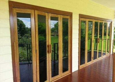 Spacious balcony with large glass doors