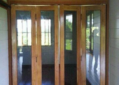 Glass folding doors leading to a room