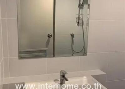 Bathroom sink with mirror and shower