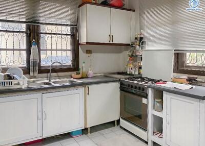 This is a photo of a kitchen with modern appliances and cabinetry.