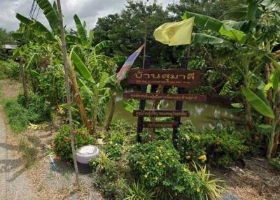 Lush garden area with a signage and greenery