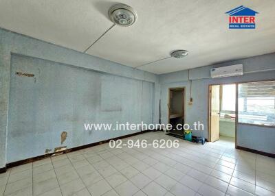 Empty room with tile flooring and two ceiling lights