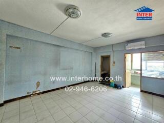 Empty room with tile flooring and two ceiling lights