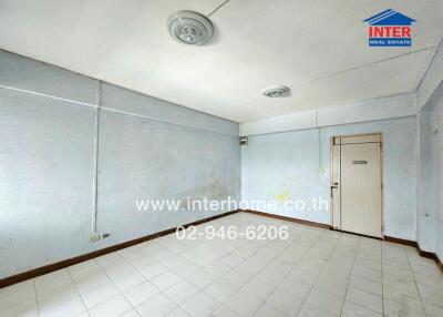 Unfurnished bedroom with tiled floor and white walls