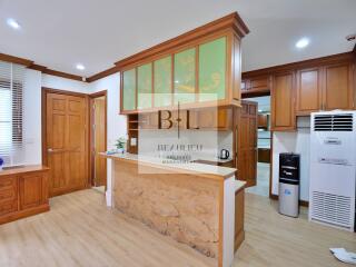 Modern kitchen with wooden cabinets and appliances