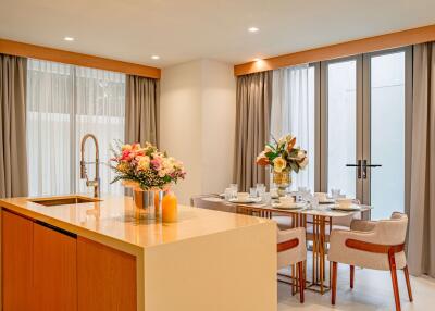 Modern kitchen and dining area with island and elegant decor