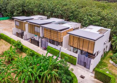 Modern row of townhouses with greenery