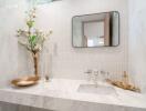 Modern bathroom with marble countertop and decorative elements