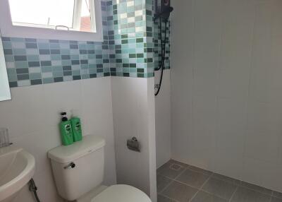 Modern bathroom with tiled shower space