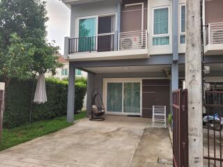 Front view of a modern two-story house with driveway